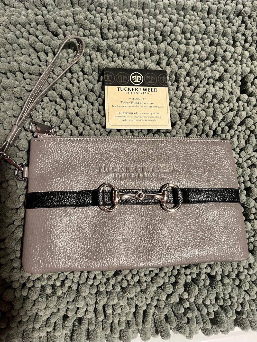 This is a Tucker Tweed Equestrian Wellington Wristlet